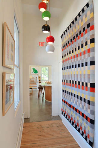 ANNI ALBERS' WALL HANGING ON THE RIGHT. MIKE YAMIN
